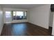 Bright living room featuring laminate wood floors at 2020 N World Parkway Blvd # 12, Clearwater, FL 33755