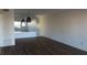 Open living room with laminate flooring and pendant lights at 2020 N World Parkway Blvd # 12, Clearwater, FL 33755