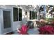 Private patio with seating area and tropical plants at 2020 N World Parkway Blvd # 12, Clearwater, FL 33755