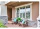 Relax on this inviting front porch, complete with rocking chairs and lush landscaping at 20292 Sea Glass Cir, Land O Lakes, FL 34638