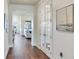 Bright hallway with hardwood floors, leading to living areas at 20292 Sea Glass Cir, Land O Lakes, FL 34638