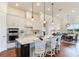 Modern kitchen with white cabinets, quartz countertops, and stainless steel appliances at 20292 Sea Glass Cir, Land O Lakes, FL 34638