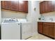 Laundry room with washer, dryer, and cabinets at 20292 Sea Glass Cir, Land O Lakes, FL 34638