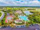 Aerial view of community pool, tennis courts, and clubhouse at 2202 Clubhouse Dr # 173, Sun City Center, FL 33573