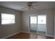 Bedroom with wood floors, a window, and sliding door to balcony at 2202 Clubhouse Dr # 173, Sun City Center, FL 33573