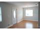 Simple dining area with hardwood floors and a window at 2202 Clubhouse Dr # 173, Sun City Center, FL 33573