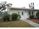 Inviting exterior of a single-story home with well-manicured landscaping at 2202 Clubhouse Dr # 173, Sun City Center, FL 33573