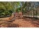 playground with slides and climbing structures, nestled among trees at 2254 Chianti Pl # 68, Palm Harbor, FL 34683