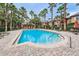 Inviting community pool with ample lounge chairs at 2254 Chianti Pl # 68, Palm Harbor, FL 34683