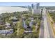 Aerial view of townhouses near water with city skyline in background at 2519 Crowder Ln, Tampa, FL 33629