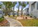 Landscaped backyard with fire pit and walkway at 2519 Crowder Ln, Tampa, FL 33629