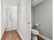 Clean and updated half bathroom with white toilet and gray walls at 2519 Crowder Ln, Tampa, FL 33629