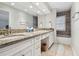 Double vanity bathroom with granite countertop and bathtub at 2519 Crowder Ln, Tampa, FL 33629