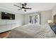 Main bedroom with king-size bed and large TV at 2519 Crowder Ln, Tampa, FL 33629