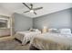 Well-lit bedroom with two beds and access to a bathroom at 2519 Crowder Ln, Tampa, FL 33629