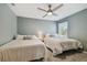 Spacious bedroom with two twin-size beds and a ceiling fan at 2519 Crowder Ln, Tampa, FL 33629