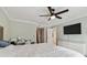 Main bedroom with king bed, dresser, and ceiling fan at 2519 Crowder Ln, Tampa, FL 33629