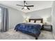 Spacious bedroom with ceiling fan and large bed at 2519 Crowder Ln, Tampa, FL 33629