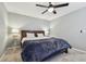 Cozy bedroom with a comfortable bed and stylish lamps at 2519 Crowder Ln, Tampa, FL 33629