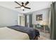 Well-lit bedroom with a ceiling fan and workspace at 2519 Crowder Ln, Tampa, FL 33629