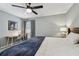 Bright bedroom with ceiling fan and large bed at 2519 Crowder Ln, Tampa, FL 33629