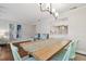 Dining room with wooden table and chairs, and view into kitchen area at 2519 Crowder Ln, Tampa, FL 33629