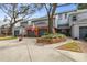 Gray townhome with double garage and manicured landscaping at 2519 Crowder Ln, Tampa, FL 33629