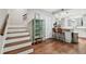 View of kitchen and staircase with wood flooring at 2519 Crowder Ln, Tampa, FL 33629