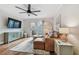 Relaxing living room featuring a leather sofa and a ceiling fan at 2519 Crowder Ln, Tampa, FL 33629