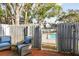 Brick patio with gray fence, gate, and pool view at 2519 Crowder Ln, Tampa, FL 33629