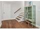 Staircase with wood treads and a green cabinet at the landing at 2519 Crowder Ln, Tampa, FL 33629