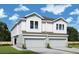 Two-story townhome with attached garage and modern exterior finishes at 2708 W North A St # 1, Tampa, FL 33609