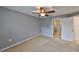 Bright bedroom with ceiling fan, neutral walls and carpet at 2803 Santego Bay Ct, Brandon, FL 33511