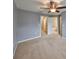 Bedroom with neutral walls, carpet, ceiling fan and access to bathroom at 2803 Santego Bay Ct, Brandon, FL 33511