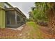 Screened porch and side yard with landscaping at 2803 Santego Bay Ct, Brandon, FL 33511