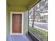 Screened-in porch with brown front door leading into the home at 2803 Santego Bay Ct, Brandon, FL 33511