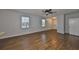 Hardwood floor living room with open concept to kitchen and stairs at 2803 Santego Bay Ct, Brandon, FL 33511