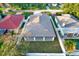 Aerial view showcasing a home's backyard, featuring a covered patio and a fenced-in area at 2905 W Collins St, Tampa, FL 33607