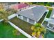 An aerial view of the backyard showing a covered patio, a fenced yard, and a glimpse of a pool at 2905 W Collins St, Tampa, FL 33607