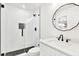 Modern bathroom with a frameless glass shower and black accents at 2905 W Collins St, Tampa, FL 33607