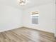 Simple bedroom with hardwood floors and a large window at 2905 W Collins St, Tampa, FL 33607