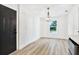 Light-filled dining area featuring hardwood floors and a window at 2905 W Collins St, Tampa, FL 33607