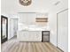 White kitchen with quartz countertops and a mini-fridge at 2905 W Collins St, Tampa, FL 33607