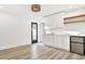 White kitchen with quartz countertops and a mini-fridge at 2905 W Collins St, Tampa, FL 33607