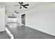 Covered patio with ceiling fans and grey tile flooring at 2905 W Collins St, Tampa, FL 33607