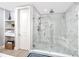 Large walk-in shower with marble tile and built-in seat at 300 150Th Ave # 502, Madeira Beach, FL 33708