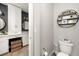 Powder room with toilet and shelving at 300 150Th Ave # 502, Madeira Beach, FL 33708