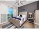 Bedroom with a queen-size bed and balcony access at 300 150Th Ave # 502, Madeira Beach, FL 33708