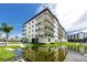 Modern building exterior with water views at 300 150Th Ave # 502, Madeira Beach, FL 33708