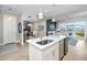 Modern kitchen island with seating and stainless steel appliances at 300 150Th Ave # 502, Madeira Beach, FL 33708